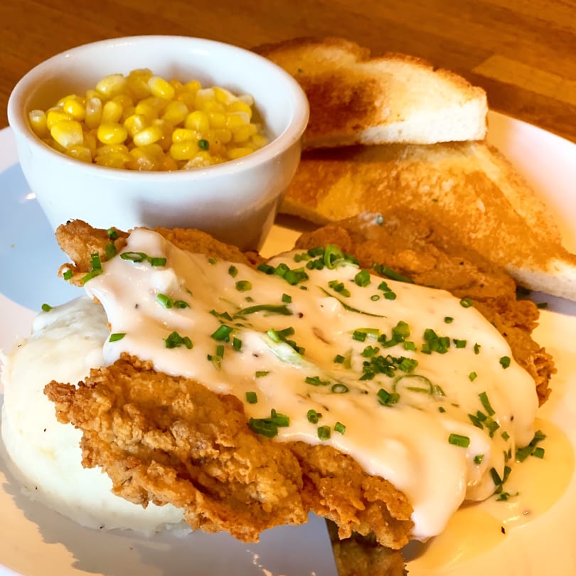 Flips Patio Grill's chicken fried steak with gravy, mashed potatoes, corn, and Texas toast.